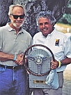 Thos. L. Bryant with Brian Redman accepting R&T Magazine’s “The Car We Would Most Like To Race” trophy designed and hand-fabricated by Dwight H. Bennett, on behalf of the Collier Automotive Museum.