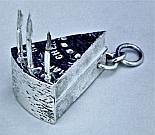 One-off Sterling Silver Bracelet Charm of a piece of Birthday Cake with candles and wicks, designed and hand-fabricated by Dwight H. Bennett