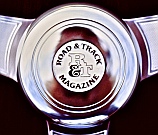 Sterling Silver Road & Track Magazine’s Logo mounted in a custom polished aluminum horn button to replace Nardi’s plastic button, designed and hand-fabricated by Dwight H. Bennett.