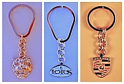 Chain-Pendant Key Rings:  14K Gold Jaguar Bas-Relief, Sterling Silver Lotus and 14K Gold Porsche designed and produced by Dwight H. Bennett.