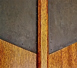 Brass Nails Line the Edge of Copper Panels Applied to Front Doors (to mimic a reflection of the A-frame window above them), an additional subtle detail produced by Dwight H. Bennett.