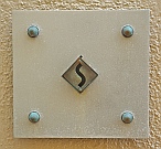 One-off Aluminum Doorbell with an Automotive Photographer’s Signature Logo as the button after 14 years near the ocean, designed and hand-fabricated by Dwight H. Bennett.